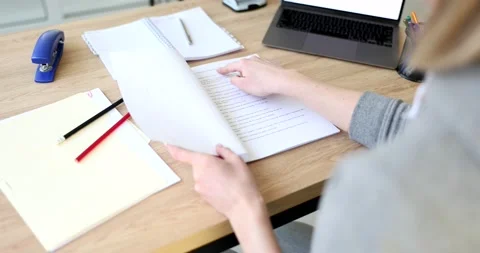 Woman opens script and reads plot of new film Stock Footage 233319031