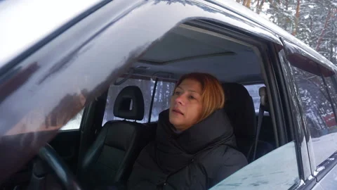Woman opens a window in the car. Stock Footage 102659088