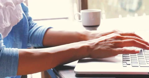 A woman operating a computer Stock Footage 161942772