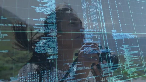 Woman operating DSLR camera capturing hills, overlaying grid and code text Stock Footage 309104569