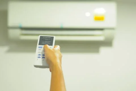 Woman operating remote controller. Stock Photos
