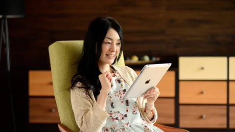 Woman operating a tablet Stock Footage 161903549