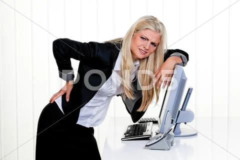 Woman with pain in the back office Stock Photos