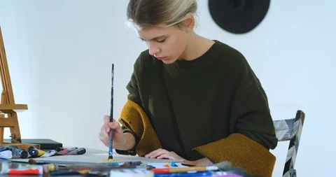 Woman painter in workshop Stock Footage 125313137