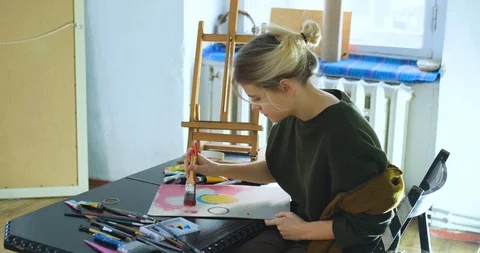 Woman painter in workshop Stock Footage 125313694