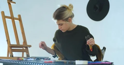 Woman painter in workshop Stock Footage 125313710