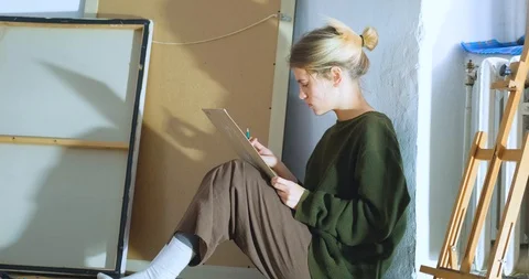 Woman painter in workshop Stock Footage 125313792