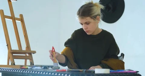 Woman painter in workshop Stock Footage 125313840