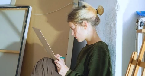 Woman painter in workshop Stock Footage 125313874