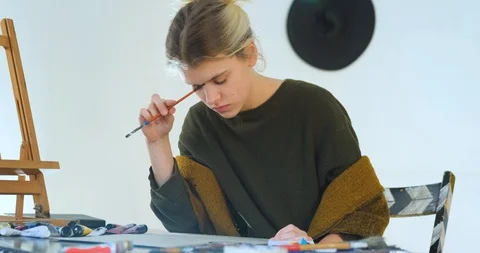 Woman painter in workshop Stock Footage 125313925