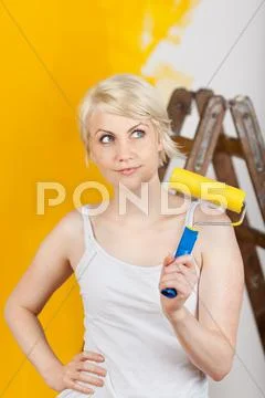 Woman painting and planning something Stock Photos