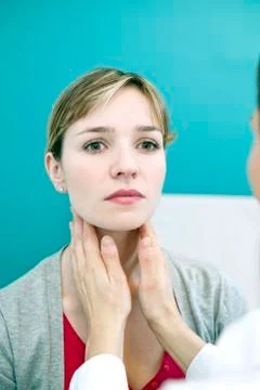 Woman palpating lymph node Stock Photos