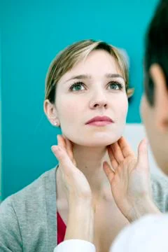 Woman palpating lymph node Stock Photos