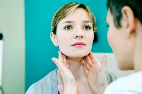 Woman palpating lymph node Stock Photos