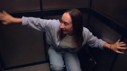 Woman In Panic Attack Stuck Inside Small Elevator Stock Footage 313754560