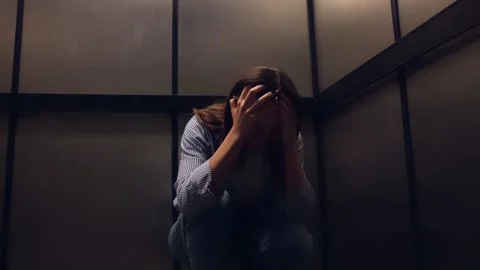 Woman In Panic Attack Stuck Inside Small Elevator Stock Footage 314132787