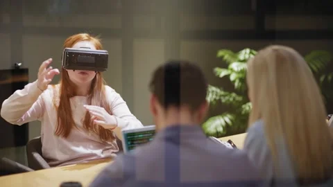 Woman participating in virtual reality testing Stock Footage 142062971