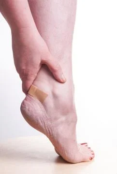 Woman with Patch on the Ankle Stock Photos
