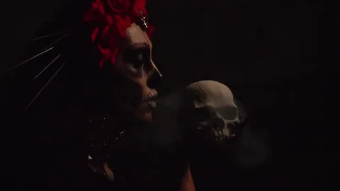 A woman with a pattern on her face in the style of the Goddess of Death or Stock Footage 229842465