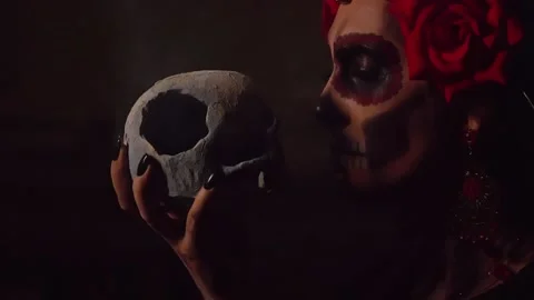 A woman with a pattern on her face in the style of the Goddess of Death or Stock Footage 229842533
