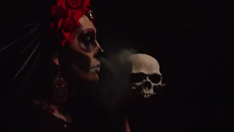A woman with a pattern on her face in the style of the Goddess of Death with a Stock Footage 229842640