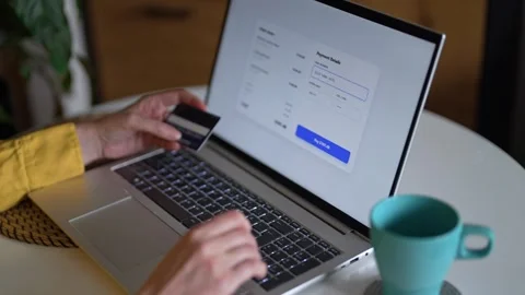 Woman paying online using credit card and laptop at home. Stock Footage 340276128