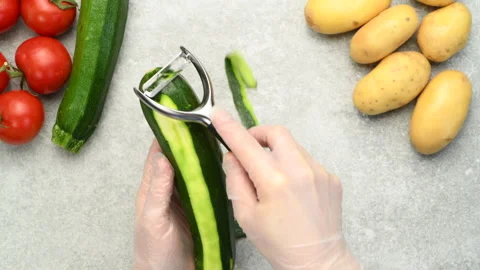 https://images.pond5.com/woman-peeling-fresh-zucchini-or-footage-146476748_iconl.jpeg