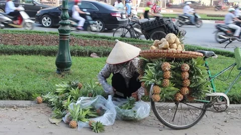 Woman is peeling pineapples Stock Footage 58626104