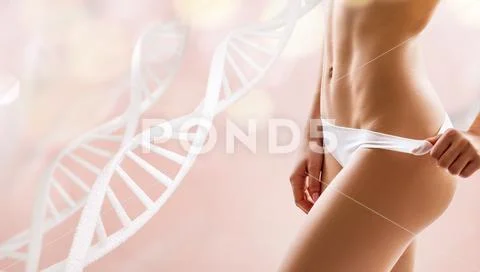 Woman with perfect body near DNA stems. Stock Photos