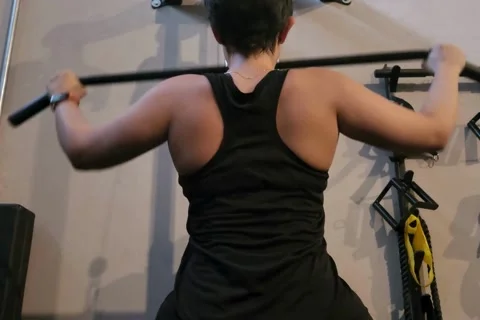 Woman Performing Lat Pulldown Exercise at the Gym Stock Footage 315006118