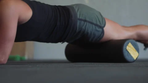 Woman performing pull ups on mat to enhance fitness at gym Stock Footage 312757105