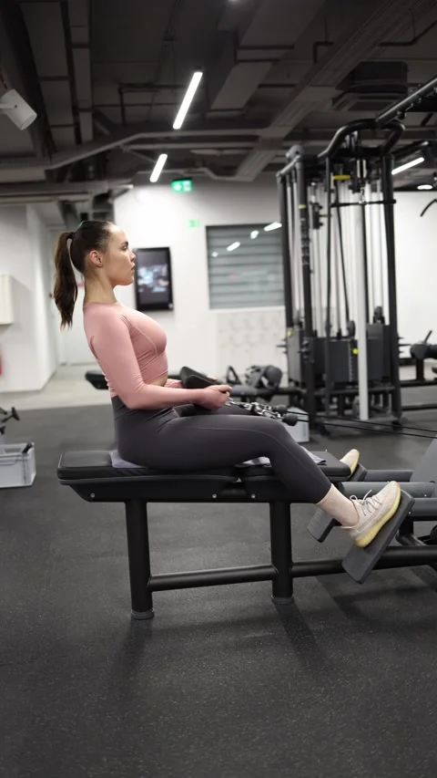 Woman performing seated cable row Stock Footage 337956965