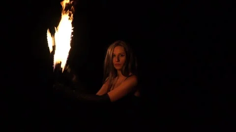 Woman Performs Fire Show and Spins Fireballs Stock Footage 141813820