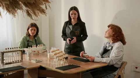 Woman Perfumer Explaining Fragrance Creation to Women in Master Class Stock-Footage 337109309