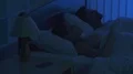 The woman phone on the bed near the man. night time 4k or 4k+ Resolution