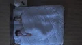 The woman phone in the bed. night time. view from above 4k or 4k+ Resolution