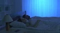 The woman phone on the bed. night time 4k or 4k+ Resolution