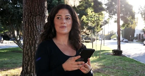 Woman on Phone, discovers something amusing, happy, outdoors, laughs Stock Footage 122233729