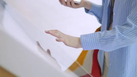 Woman is on the phone while touching a screen Stock Footage 306666192