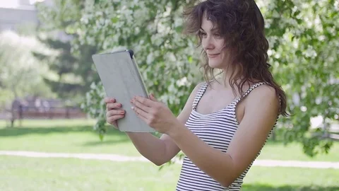Woman photographed themselves on the phone in the Park Stock Footage