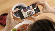 Woman Photographing Her Breakfast In Kitchen Stock Footage