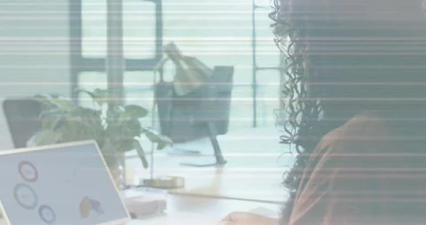 Woman picking printed chart, comparing with laptop as animated charts Stock Footage 334176166