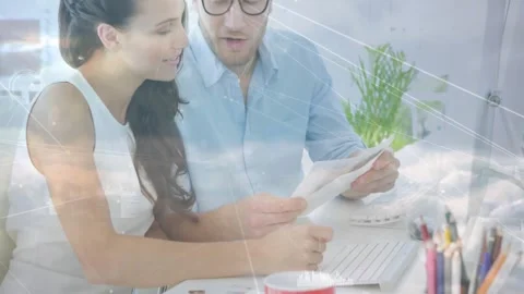 Woman picking up printed document and leading man toward computer screen ending Stock Footage 329968676