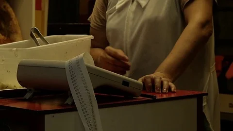 Woman picks up at the checkout counter Stock Footage