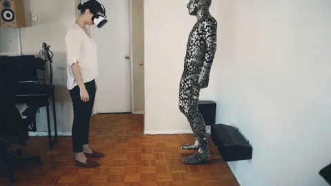 Woman picks up an object in virtual reality. Stock Footage 76411429