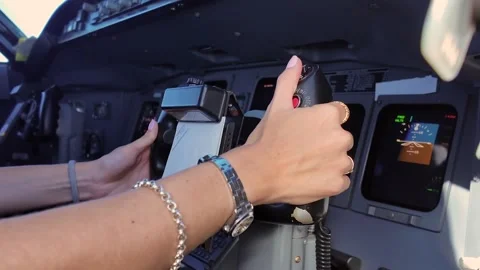 Woman Pilot Hands of the Flight Controls of a Jet Airplane in an Immersive Real Stock Footage 346502383