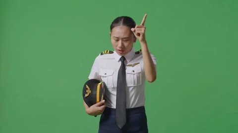 Woman Pilot Shouting To Camera While Standing In The Green Screen Background Stock Footage 251641207