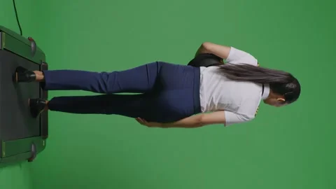 Woman Pilot Waving Hand While Walking On Treadmill In The Green Screen Stock Footage 251687421