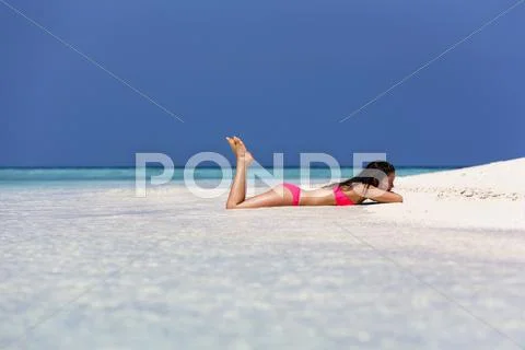 Woman In A Pink Bikini Lying On The Beach Male North Male Atoll Maldives Asia
