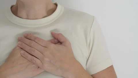 Woman Placing Both Hands Over Heart in Loving Gesture Stock Footage 344972954